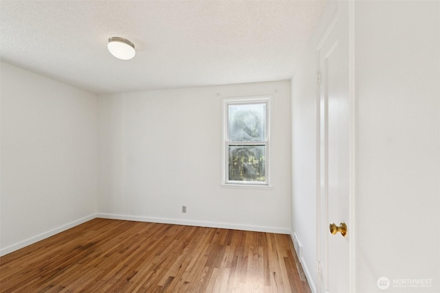 14326 Meridian Ave N, Seattle, WA 98133 - spare room featuring wood finished floors and baseboards