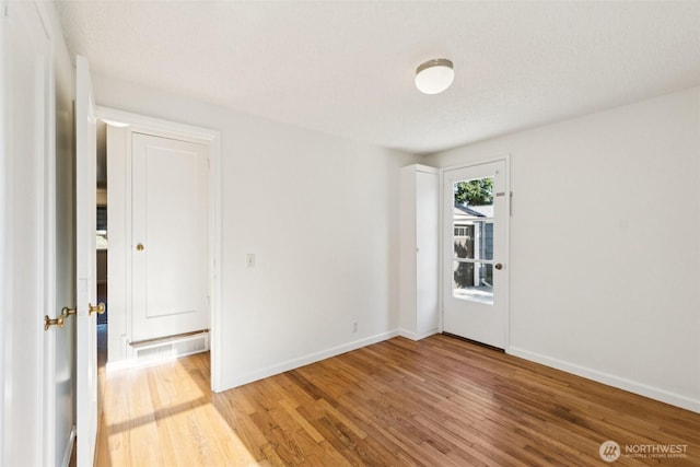 14326 Meridian Ave N, Seattle, WA 98133 - spare room featuring wood finished floors and baseboards