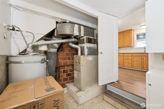 14326 Meridian Ave N, Seattle, WA 98133 - utility room featuring secured water heater