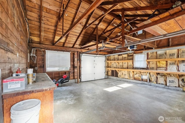 14326 Meridian Ave N, Seattle, WA 98133 - garage featuring a garage door opener, wooden walls, and wood ceiling