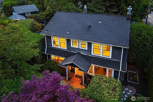 1600 Interlaken Pl E, Seattle, WA 98112 - view of front of house with a chimney, covered porch, and roof with shingles