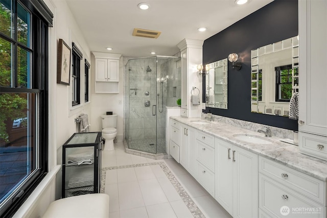 1600 Interlaken Pl E, Seattle, WA 98112 - bathroom with tile patterned flooring, a shower stall, double vanity, recessed lighting, and inlaid floor details
