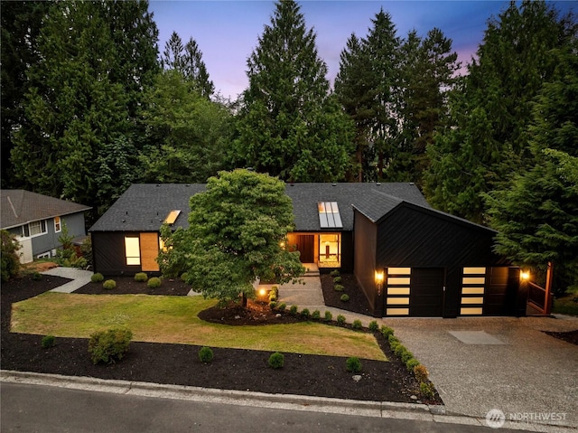 9320 Hoeder Ln, Bothell, WA 98011 - view of front facade featuring driveway, an attached garage, and a yard