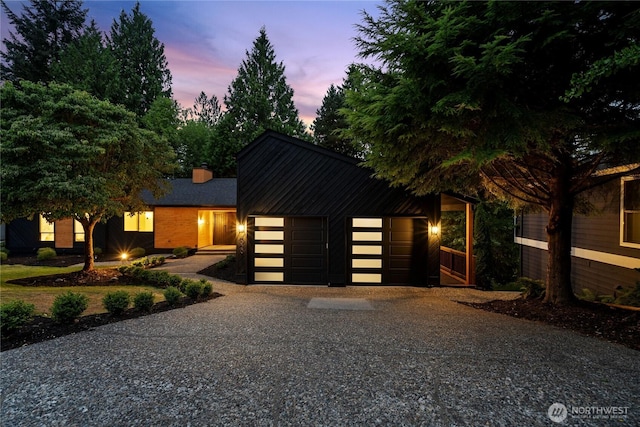 9320 Hoeder Ln, Bothell, WA 98011 - contemporary home featuring a garage and a chimney