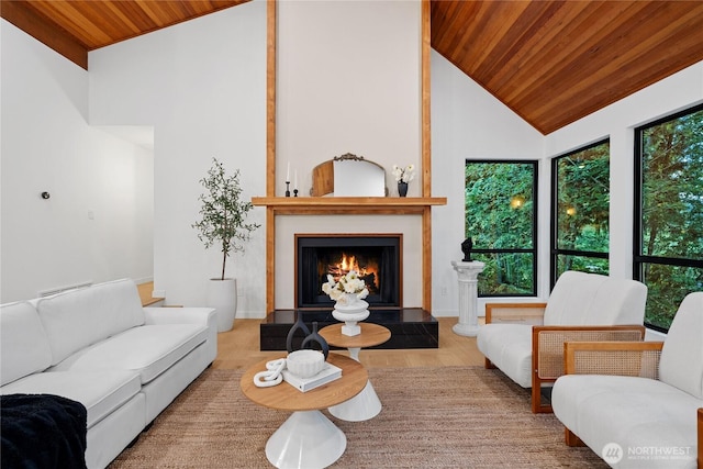 9320 Hoeder Ln, Bothell, WA 98011 - living room featuring wood ceiling, plenty of natural light, a large fireplace, wood finished floors, and high vaulted ceiling