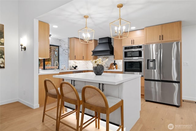 9320 Hoeder Ln, Bothell, WA 98011 - kitchen with appliances with stainless steel finishes, premium range hood, a chandelier, light brown cabinets, and light countertops