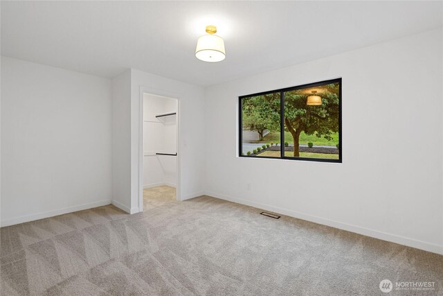 9320 Hoeder Ln, Bothell, WA 98011 - unfurnished bedroom with carpet flooring and a walk in closet