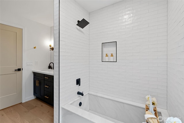 9320 Hoeder Ln, Bothell, WA 98011 - bathroom with vanity, wood finished floors, and tub / shower combination