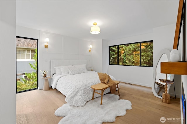 9320 Hoeder Ln, Bothell, WA 98011 - bedroom featuring light wood-type flooring and baseboards