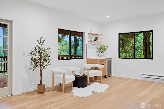 9320 Hoeder Ln, Bothell, WA 98011 - living area featuring beverage cooler, light wood-style flooring, a baseboard radiator, and recessed lighting