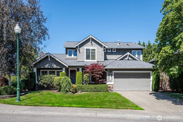 12530 68th Ave SE, Snohomish, WA 98296 - view of front facade with a shingled roof, driveway, a front yard, and an attached garage