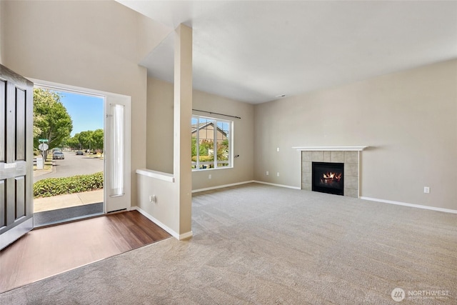 5723 66th Ave SE, Lacey, WA 98513 - unfurnished living room with carpet flooring and a tile fireplace