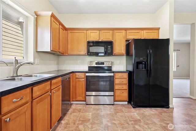 5723 66th Ave SE, Lacey, WA 98513 - kitchen featuring black appliances, dark countertops, and brown cabinets