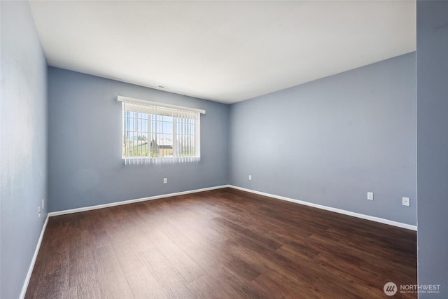 5723 66th Ave SE, Lacey, WA 98513 - spare room with dark wood-type flooring and baseboards