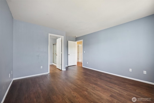5723 66th Ave SE, Lacey, WA 98513 - empty room with baseboards and dark wood-style flooring