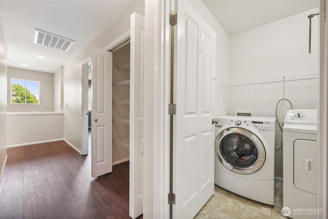 5723 66th Ave SE, Lacey, WA 98513 - laundry room featuring washer and clothes dryer and wood finished floors