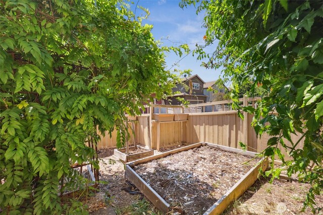 5723 66th Ave SE, Lacey, WA 98513 - fenced backyard featuring a vegetable garden