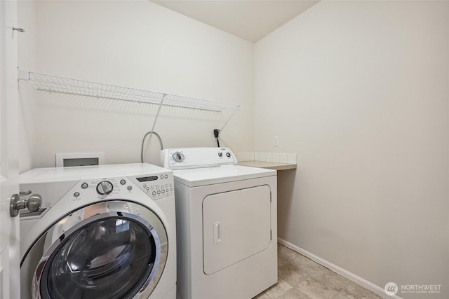5723 66th Ave SE, Lacey, WA 98513 - washroom featuring separate washer and dryer and baseboards