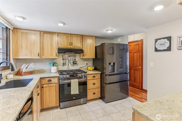1435 S 263rd Pl, Des Moines, WA 98198 - kitchen featuring appliances with stainless steel finishes, under cabinet range hood, light stone countertops, and light tile patterned flooring
