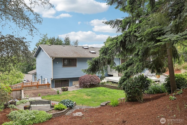 1435 S 263rd Pl, Des Moines, WA 98198 - rear view of house with a garage, a patio area, and roof with shingles
