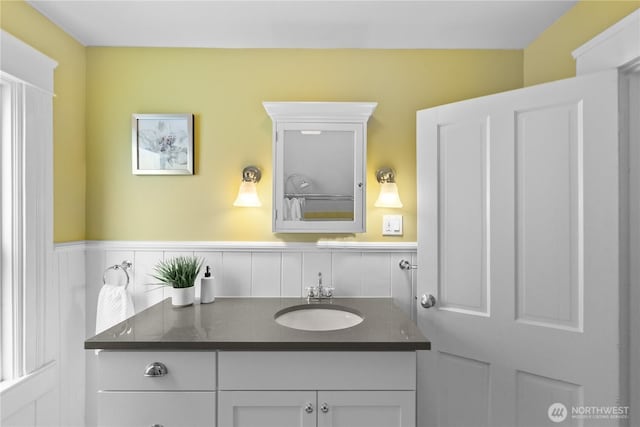 1531 NW 62nd St, Seattle, WA 98107 - bathroom featuring vanity and a wainscoted wall