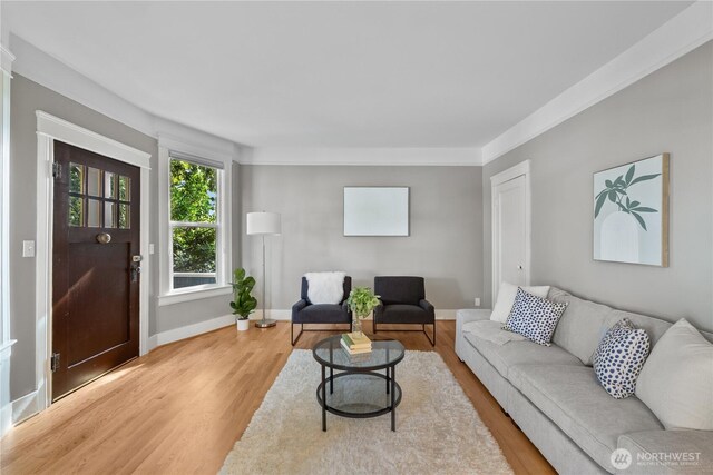 1531 NW 62nd St, Seattle, WA 98107 - living area featuring light wood-style flooring and ornamental molding