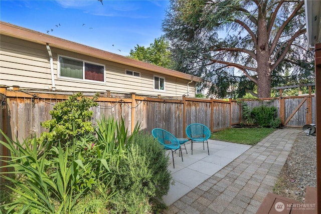 1531 NW 62nd St, Seattle, WA 98107 - fenced backyard with a patio area