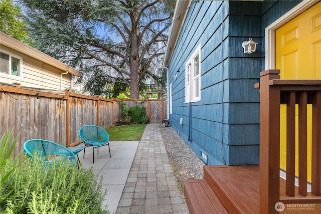 1531 NW 62nd St, Seattle, WA 98107 - fenced backyard with a patio area