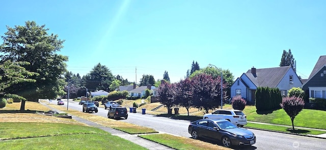 239 S 58th St, Tacoma, WA 98408 - view of asphalt road with sidewalks, curbs, a residential view, and street lights