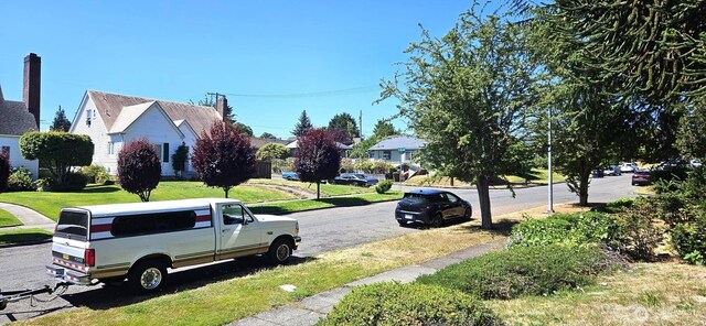 239 S 58th St, Tacoma, WA 98408 - view of asphalt road with sidewalks and curbs