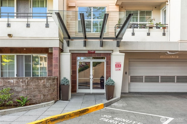 7549 SE 29th St Unit 305, Mercer Island, WA 98040 - property entrance featuring french doors and stucco siding