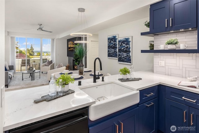 7549 SE 29th St Unit 305, Mercer Island, WA 98040 - kitchen with blue cabinetry, open floor plan, decorative backsplash, open shelves, and light countertops