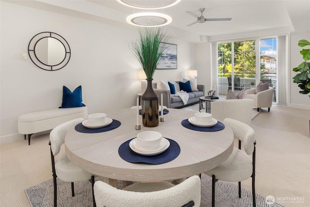 7549 SE 29th St Unit 305, Mercer Island, WA 98040 - carpeted dining room featuring baseboards and ceiling fan