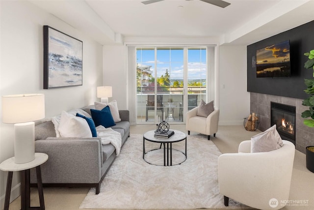 7549 SE 29th St Unit 305, Mercer Island, WA 98040 - living area with a tile fireplace, carpet, and ceiling fan