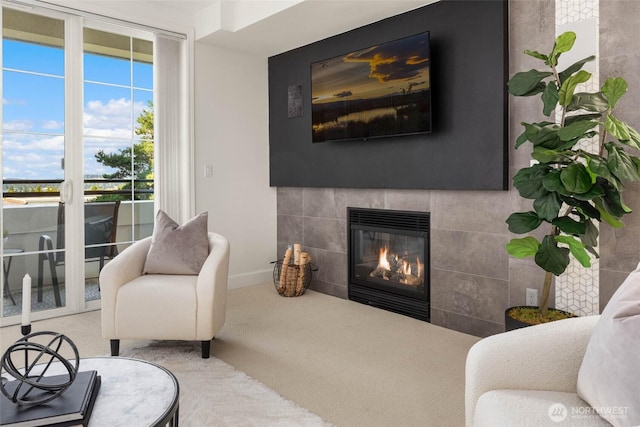 7549 SE 29th St Unit 305, Mercer Island, WA 98040 - living area with a tile fireplace and carpet