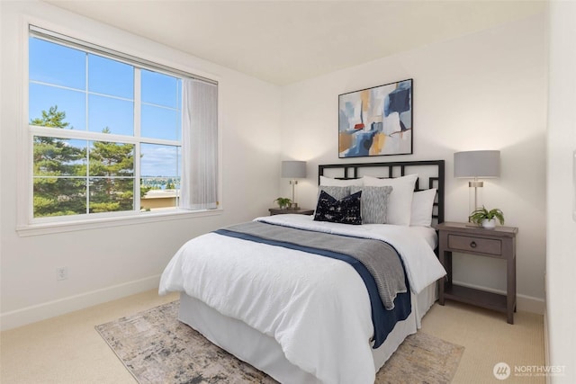 7549 SE 29th St Unit 305, Mercer Island, WA 98040 - bedroom with light carpet and baseboards