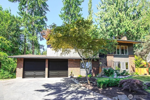 13512 106th Dr SE, Snohomish, WA 98296 - view of front facade with brick siding, driveway, and a garage