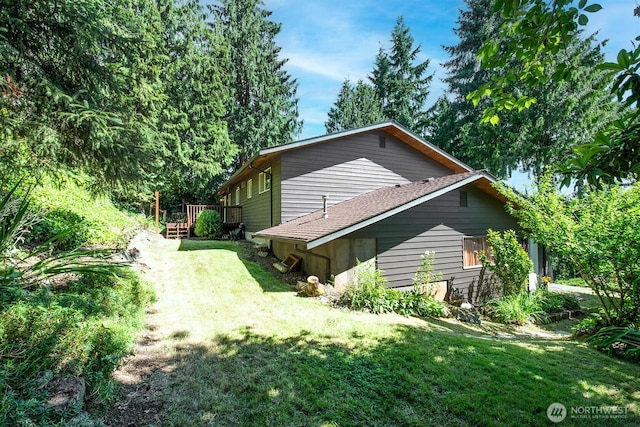 13512 106th Dr SE, Snohomish, WA 98296 - view of home's exterior featuring a deck and a lawn