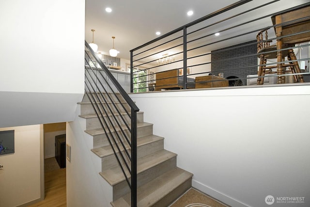 13512 106th Dr SE, Snohomish, WA 98296 - stairs featuring recessed lighting, wood finished floors, and a brick fireplace