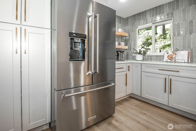 13512 106th Dr SE, Snohomish, WA 98296 - kitchen featuring high end refrigerator, light countertops, light wood-style floors, and open shelves