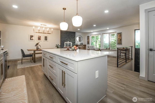 13512 106th Dr SE, Snohomish, WA 98296 - kitchen featuring light wood finished floors, light countertops, recessed lighting, a center island, and a chandelier