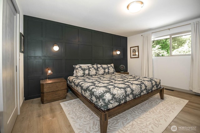 13512 106th Dr SE, Snohomish, WA 98296 - bedroom with a decorative wall and light wood finished floors