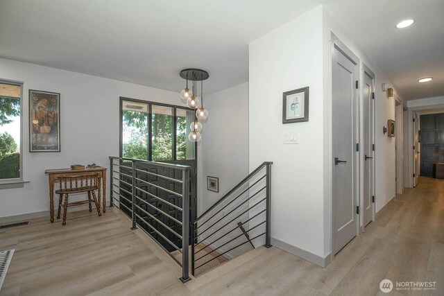 13512 106th Dr SE, Snohomish, WA 98296 - hall with an upstairs landing, light wood-type flooring, healthy amount of natural light, and recessed lighting