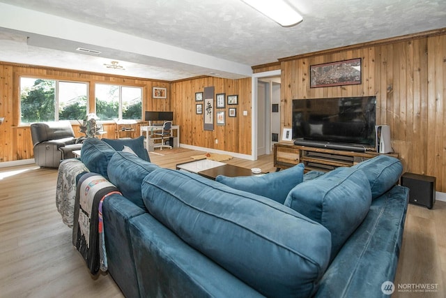 13512 106th Dr SE, Snohomish, WA 98296 - living area with wooden walls, light wood-style flooring, and a textured ceiling