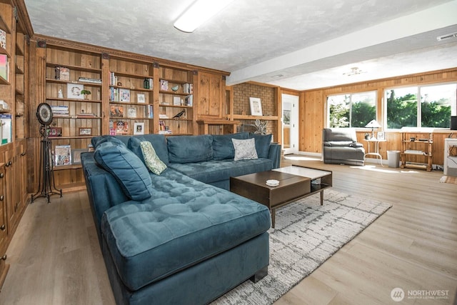 13512 106th Dr SE, Snohomish, WA 98296 - living room featuring wood finished floors, a textured ceiling, and wooden walls