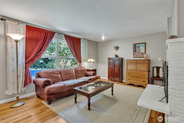 3738 S 189th Pl, Seatac, WA 98188 - living area featuring light wood-style flooring and baseboards