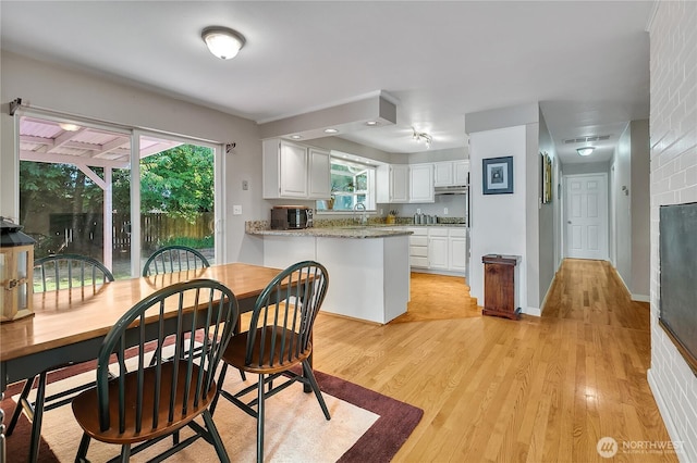 3738 S 189th Pl, Seatac, WA 98188 - dining area featuring light wood-type flooring and plenty of natural light