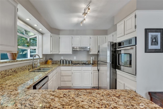 3738 S 189th Pl, Seatac, WA 98188 - kitchen with stainless steel appliances, light stone countertops, white cabinets, under cabinet range hood, and recessed lighting