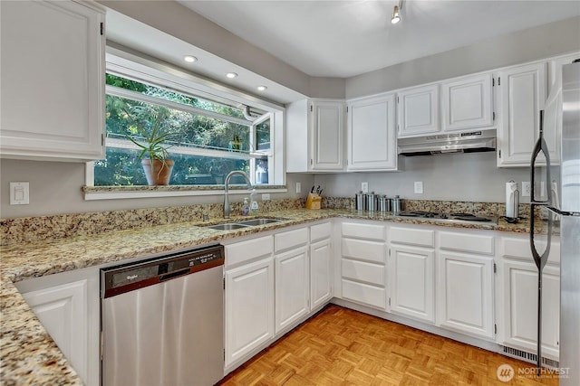 3738 S 189th Pl, Seatac, WA 98188 - kitchen featuring appliances with stainless steel finishes, under cabinet range hood, light stone counters, white cabinetry, and recessed lighting