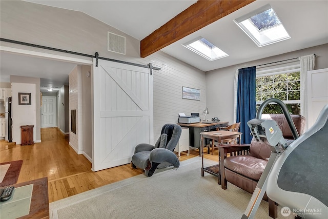 3738 S 189th Pl, Seatac, WA 98188 - office space with light wood finished floors, a skylight, and a barn door